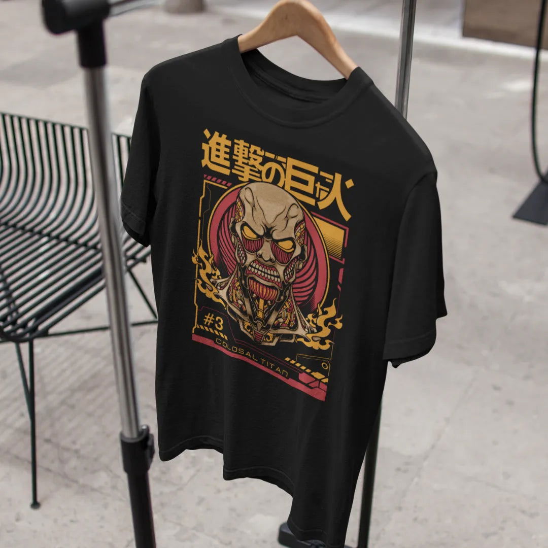 AWBlack premium black t-shirt with Colossal Titan Unleashed graphic from Attack on Titan featuring the terrifying Titan face with Japanese text '進撃の巨人' and '#3 Colossal Titan', hanging on wooden hanger, oversized fit available