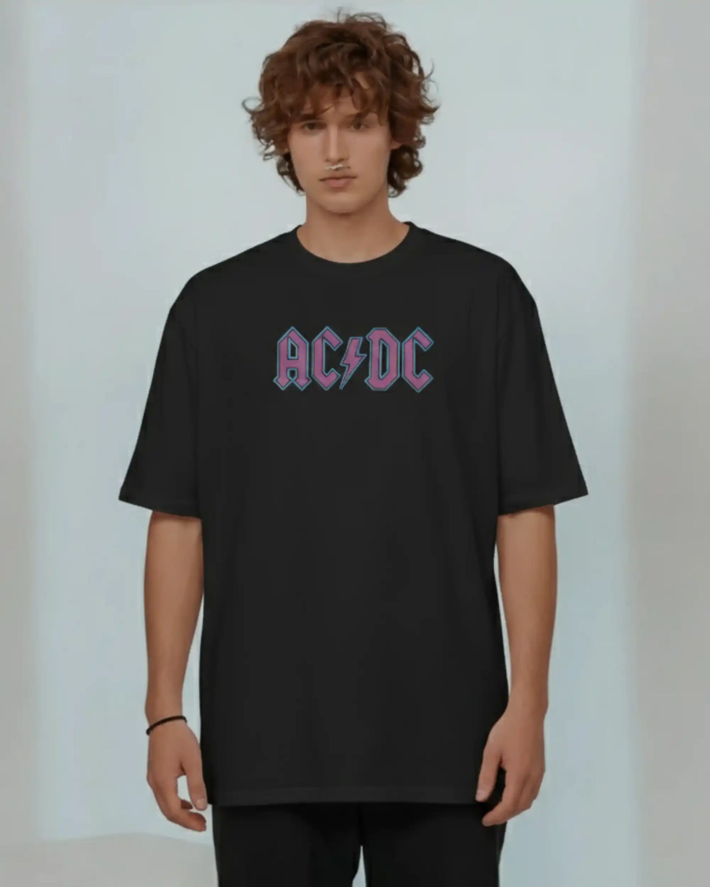 Black plus size oversized t-shirt with AC/DC logo graphic design on front, modeled against a plain background