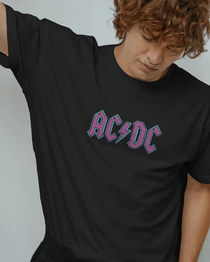 Black plus size oversized t-shirt with AC/DC logo graphic design on front, modeled in a relaxed pose