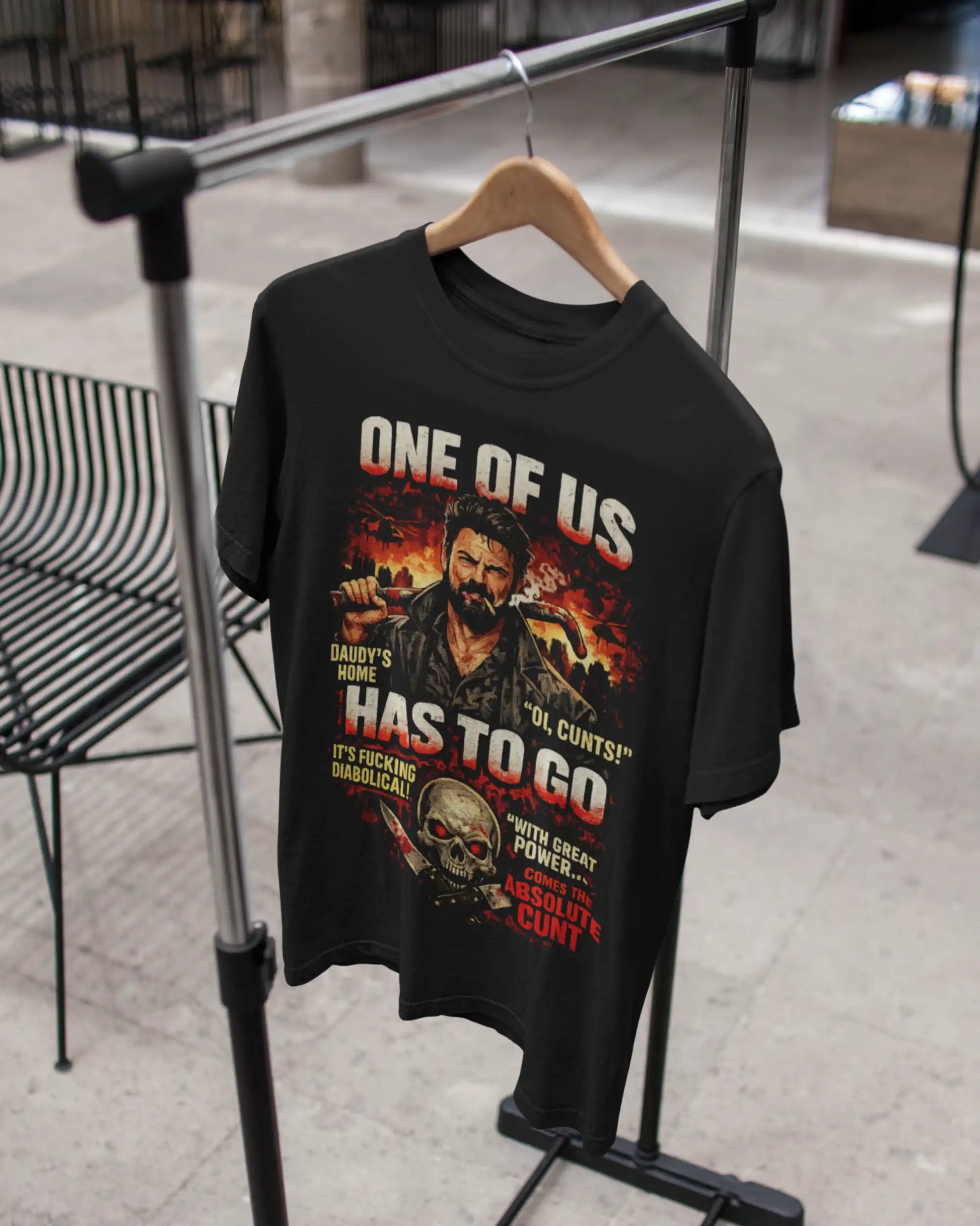 Black plus size t-shirt with 'One of Us' graphic design and movie artwork, displayed on a hanger