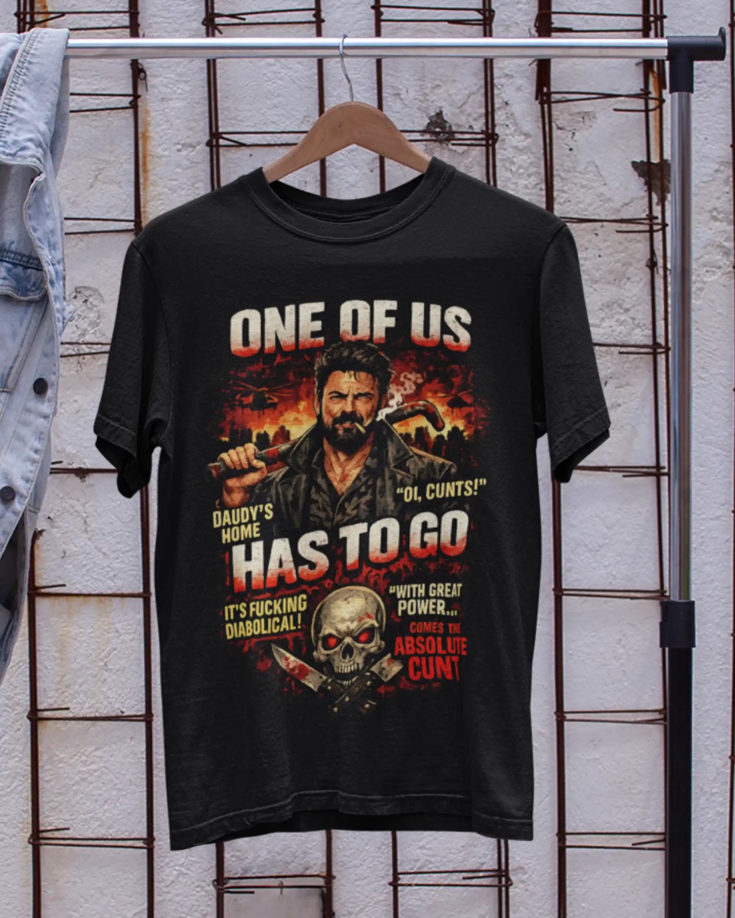 Black plus size t-shirt with 'One of Us' movie graphic design, displayed on a wooden hanger