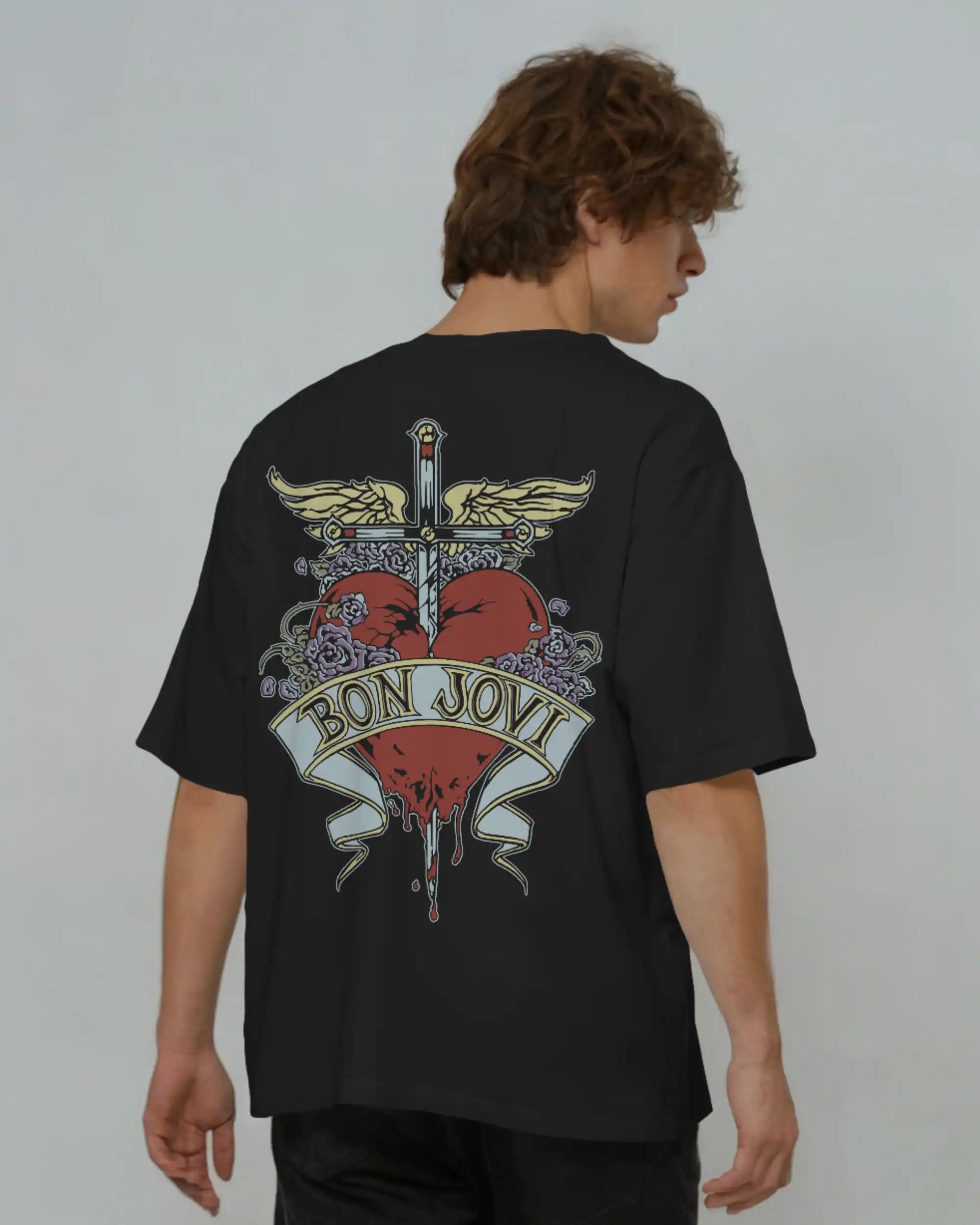 Black plus size oversized t-shirt with Bon Jovi iconic graphic design on the back, modeled against a plain background