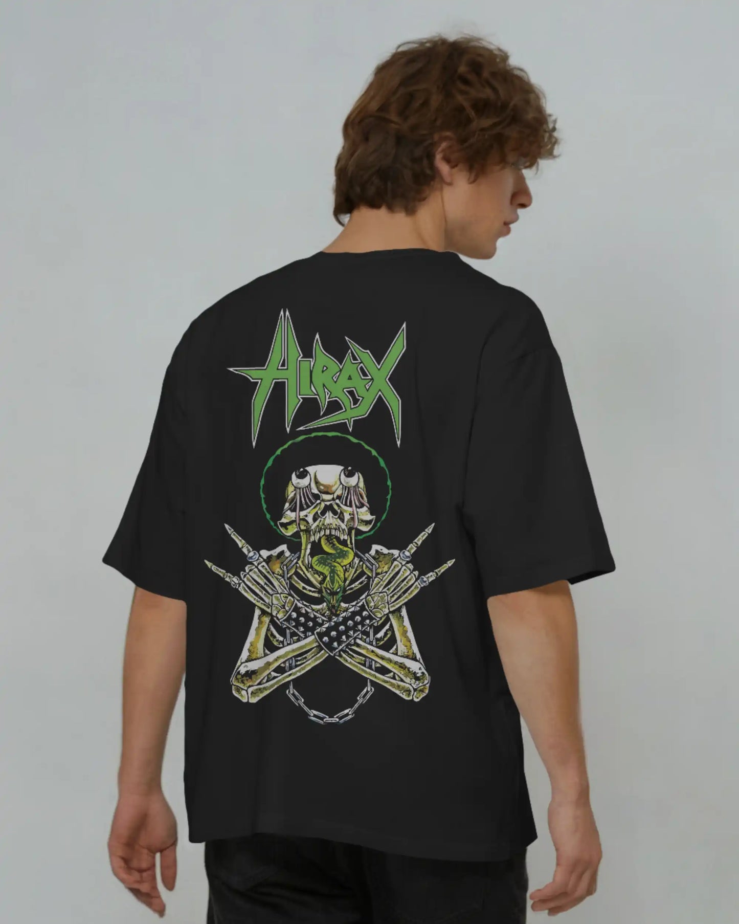 Back view of man wearing heavyweight black plus size t-shirt with Hirax thrash metal graphic, oversized streetwear fit.