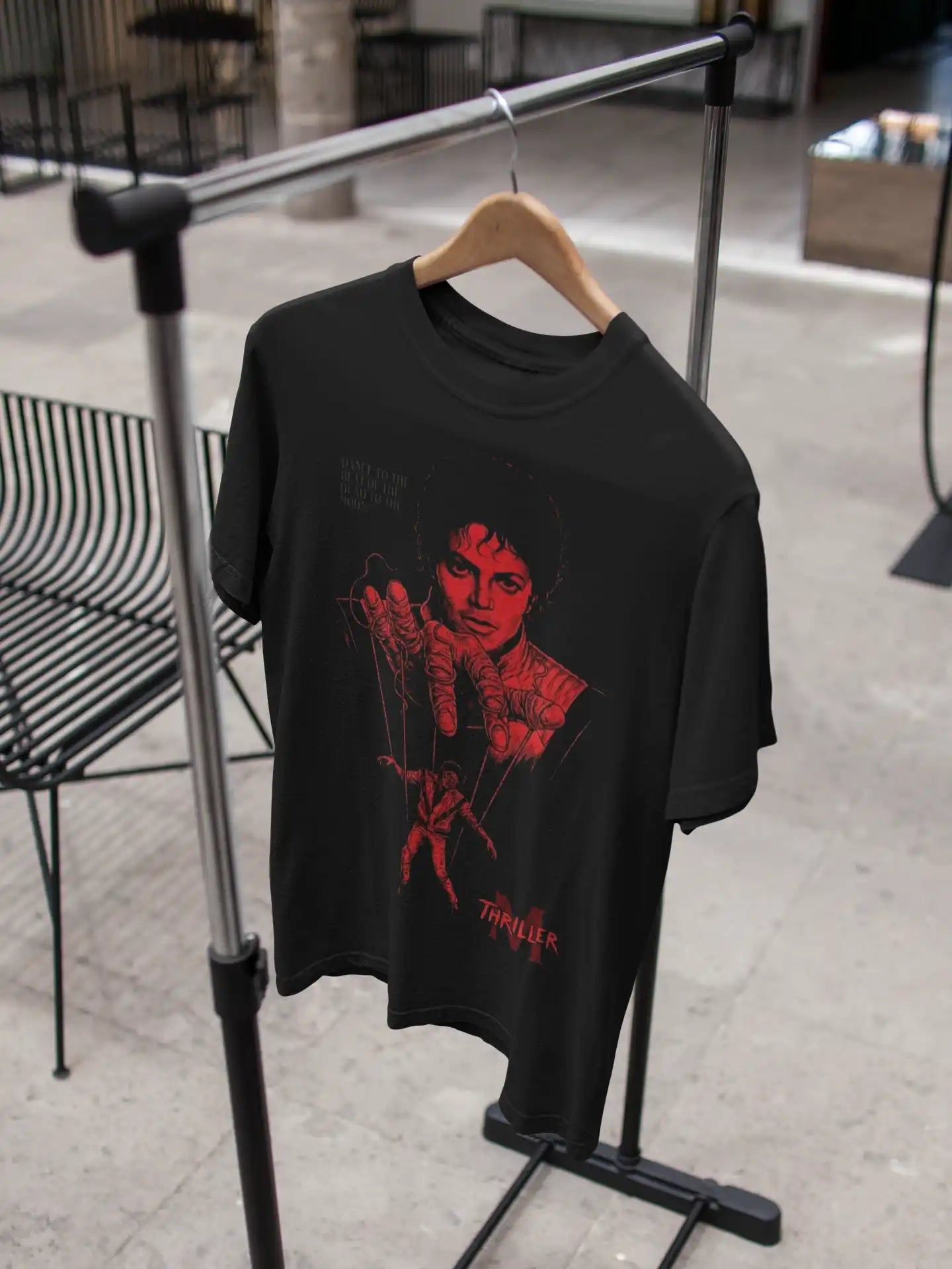 AWBlack Michael Jackson Thriller Vintage Music Puppet Graphic T-Shirt in Black hanging on wooden hanger | Premium 180 GSM Cotton | Multi-Fit Regular, Oversized & Plus Size S–7XL | Red Thriller Print Streetwear Tee for Men