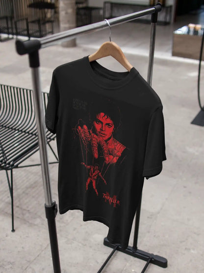 AWBlack Michael Jackson Thriller Vintage Music Puppet Graphic T-Shirt in Black hanging on wooden hanger | Premium 180 GSM Cotton | Multi-Fit Regular, Oversized & Plus Size S–7XL | Red Thriller Print Streetwear Tee for Men
